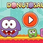 Schermata del gioco Donutsaur 2 con simpatici personaggi colorati e un pulsante di play